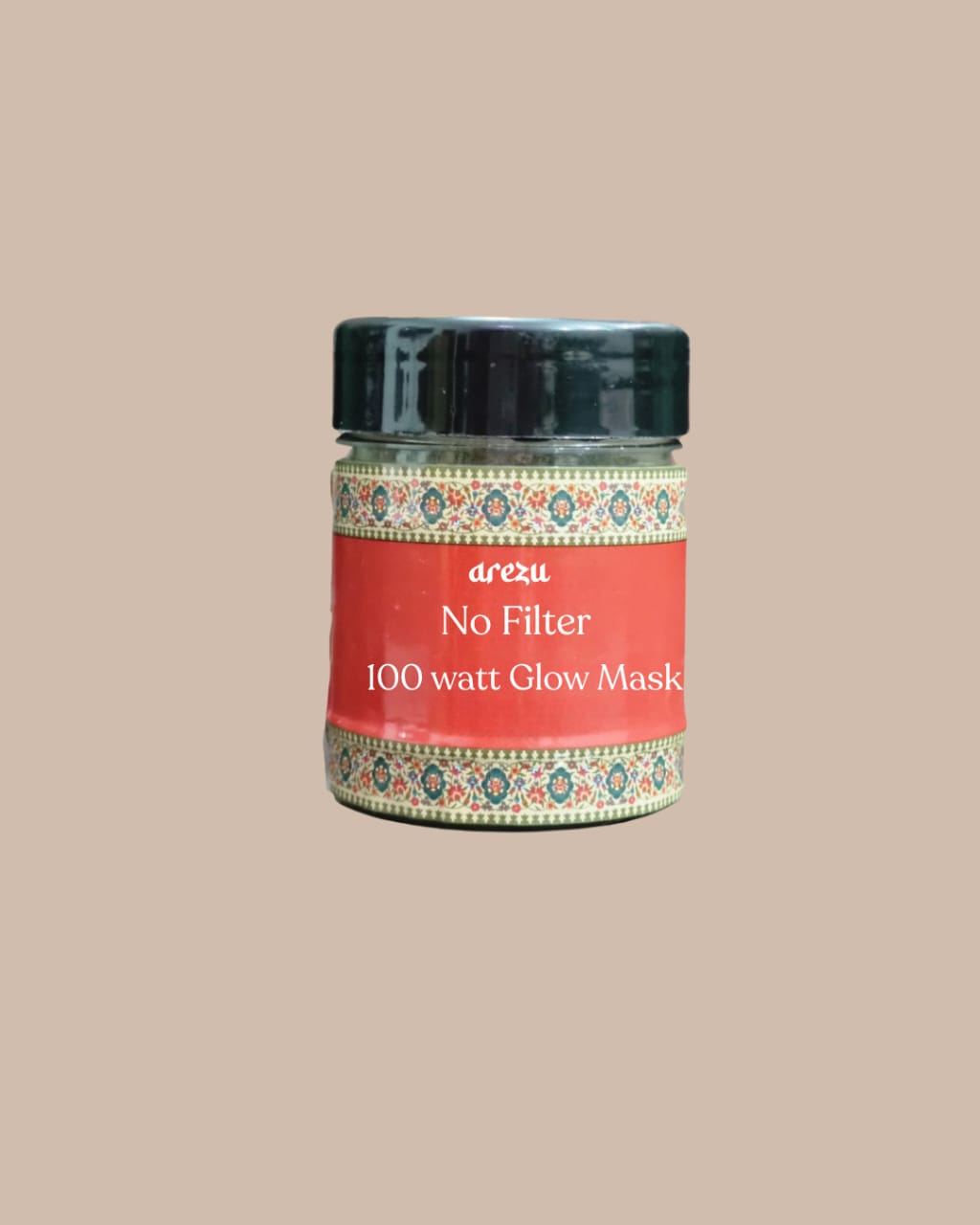 A jar labeled “Arezu 100Watt Glow Mask” with a black lid and red patterned label, formulated to fade acne marks and hyperpigmentation, displayed against a plain beige background.